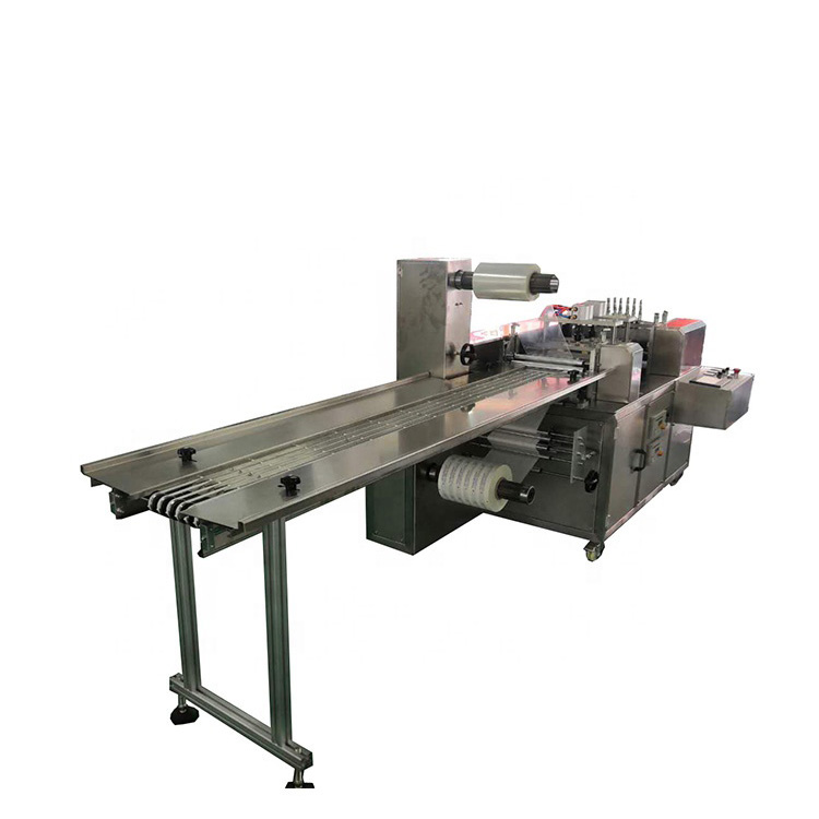 Four side seal glove packaging machine