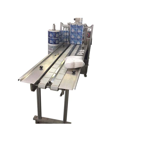 Four-side sealing face mask packaging machine